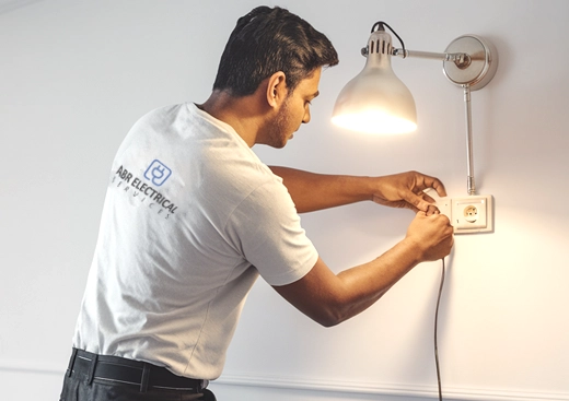 http://ABR%20electrician%20installing%20a%20wall%20lamp%20in%20Dubai%20Marina%20for%20electrical%20services