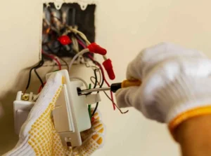 ABR electrician removing cable from an electrical socket